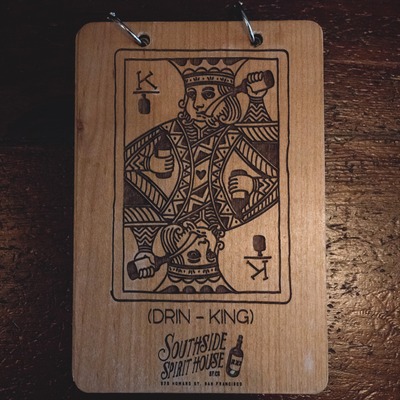 Branded wooden king playing card.