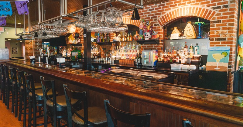 Interior, bar, chairs, drink rack behind