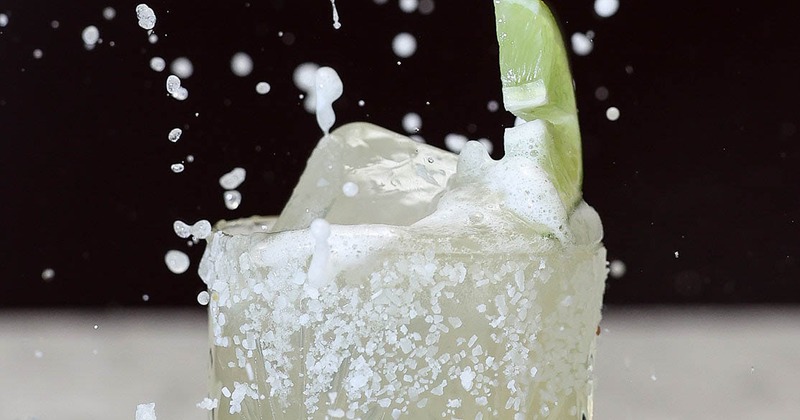 Margarita cocktail splashing on the counter