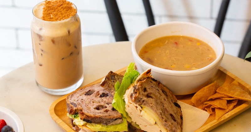 Turkey sandwich served with soup and iced coffee