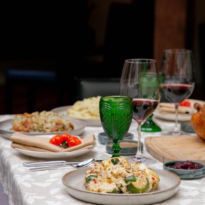 a set table with plates of food.