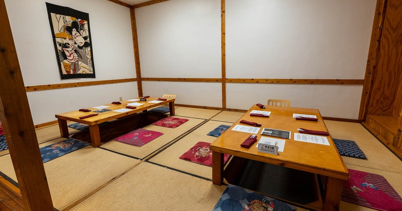 Interior, two tables with floor seating ready for guests