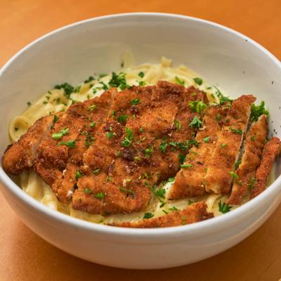 Fettuccine Alfredo with fried chicken.
