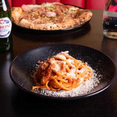Bucatini pasta with tomato sauce.
