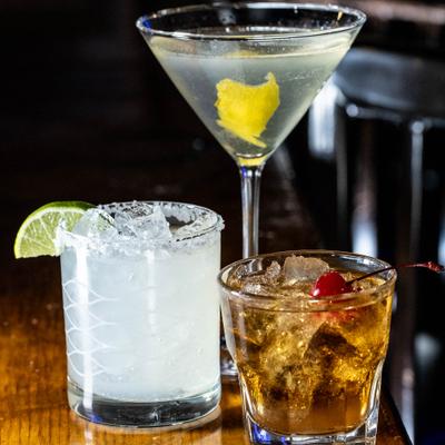 Three different cocktails served on a table.