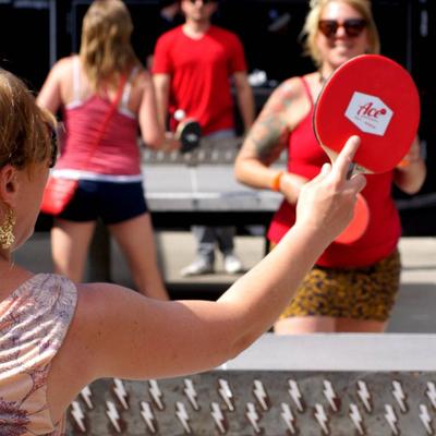 People playing table tennis.