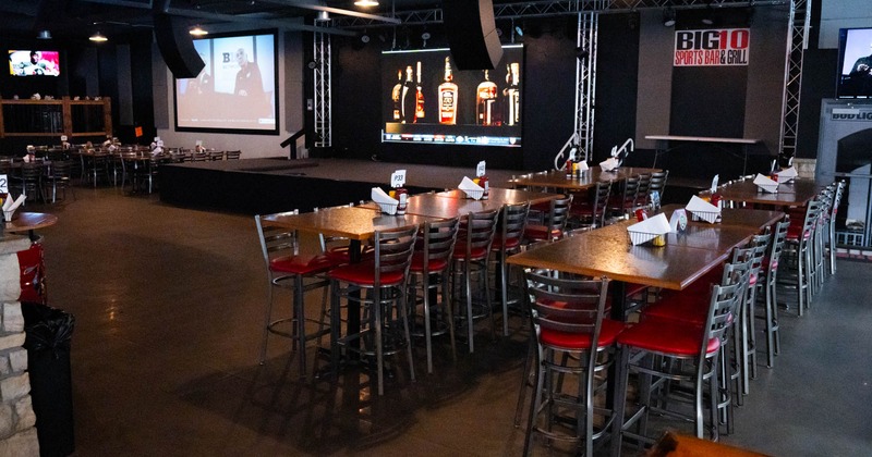 Interior, tables and chairs, stage in the back