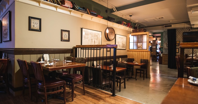 Dining area with paintings on the wall