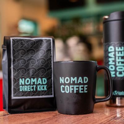 A bag of House coffee and a mug.