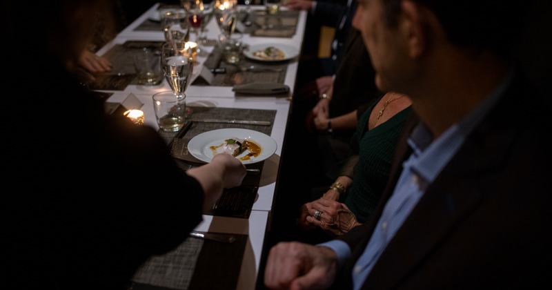Food being served to guests at the table
