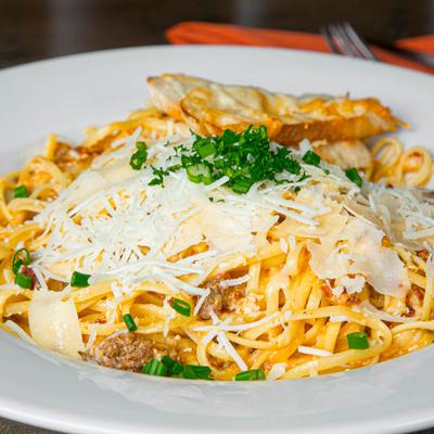 Carbonara pasta with ground beef, beef chorizo, bacon, and Parmesan.