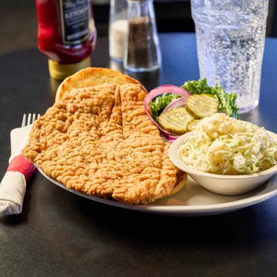 Fried Pork Tenderloin served with bread, salad and coleslaw.