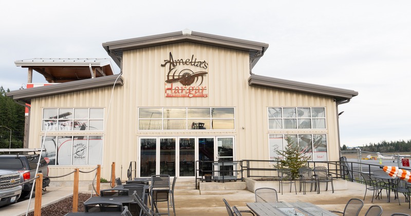 Outdoor seating area in front of the restaurant entrance
