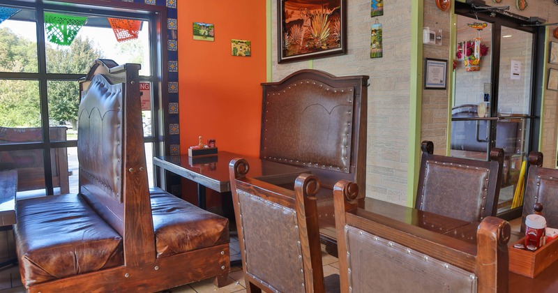 Leather booths, wooden top tables