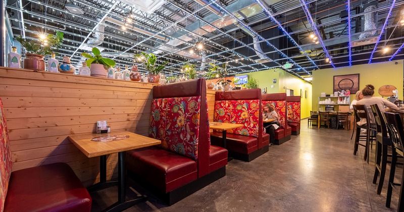 Interior space, lined-up upholstered dining booths