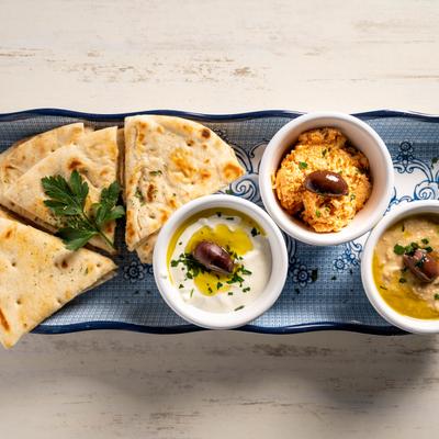 Tzatziki, hummus and spicy feta spreads