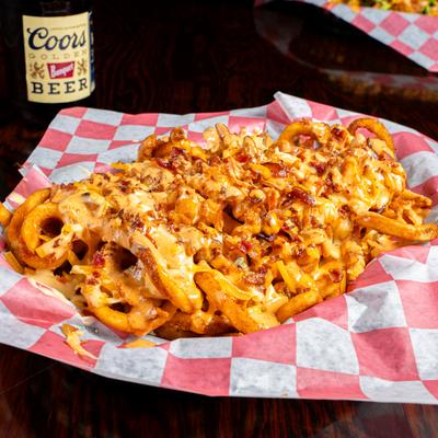 Fries with bacon, melted cheddar, and ranch sauce.