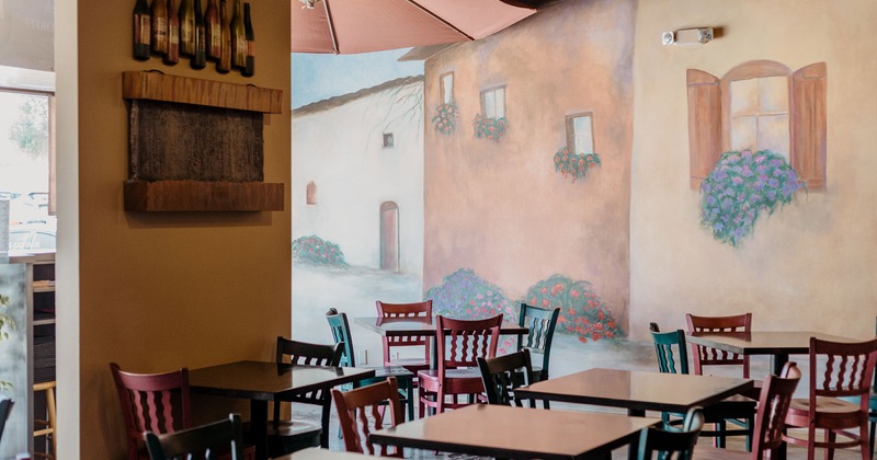 Dining area, walls decorated with mural art