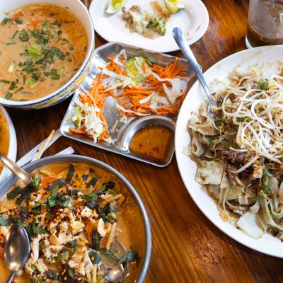 Various Thai dishes on a table.