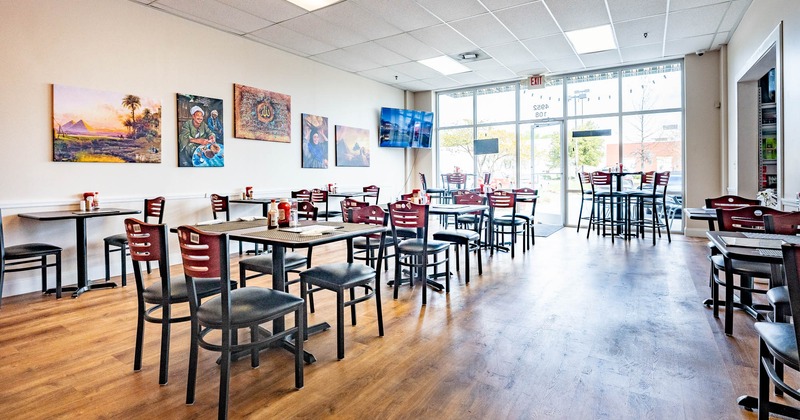 Interior, dining area, big window and entrance in the back