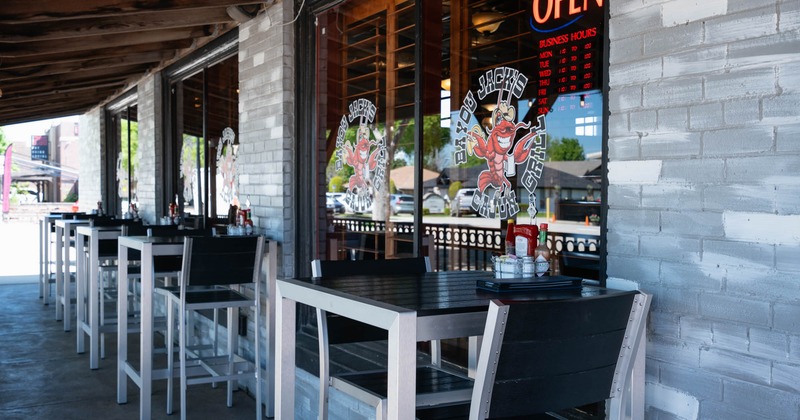 Exterior, covered patio seating with tables