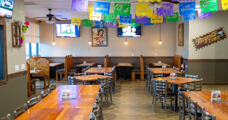 Interior, seating area, seating booths with tables, long table setup for ten people