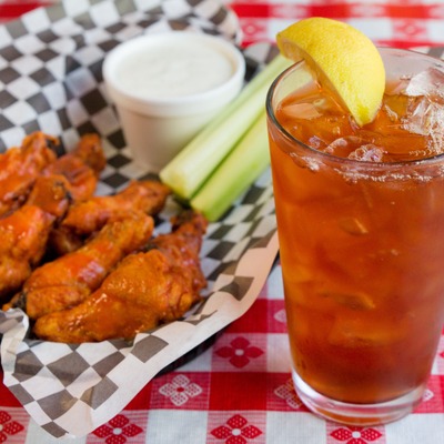 Chicken wings and a cocktail.