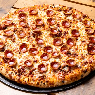 Meat Lovers Pizza, with sausage, pepperoni, ham, and bacon.
