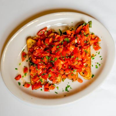Bruschetta, with tomato, basil, and garlic.