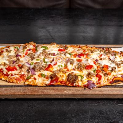 Italiano flatbread with Italian sausage, mozzarella, roasted peppers and onions.