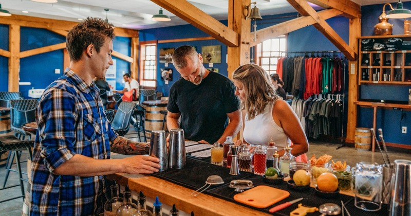 Bartender serving guests at the bar