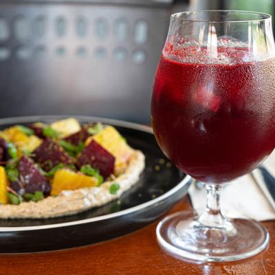 Beet salad and a red cocktail.