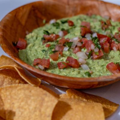 Guacamole dip served with chips.