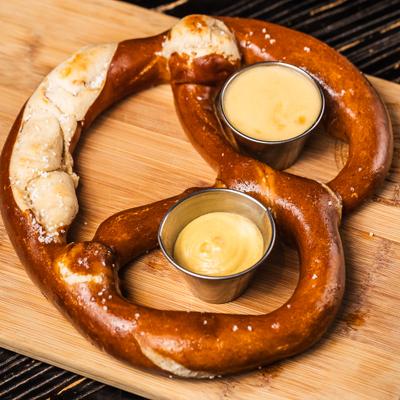 Big Bavarian pretzel served with a cheese dip.