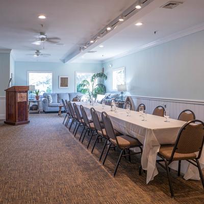Interior, long table ready for guests