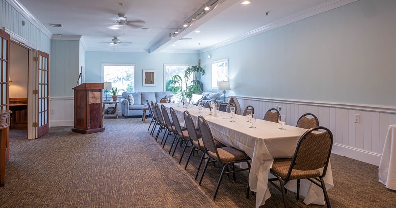 Interior, long table ready for guests