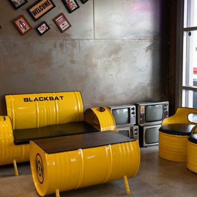 Metal barrel chairs, sofa, and table.