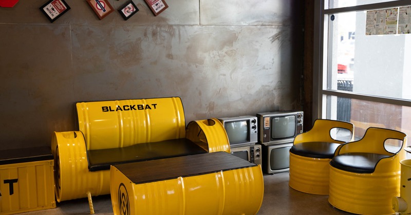 Metal barrel chairs, sofa, and table