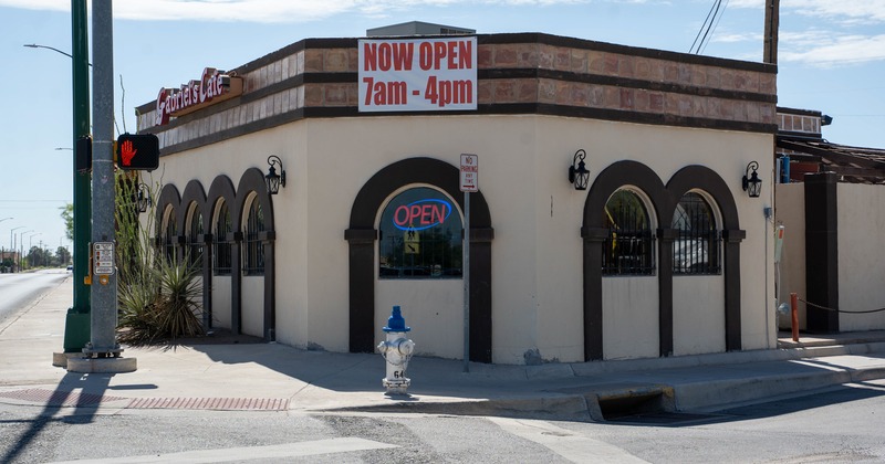Exterior, angle view to restaurant,  entrance, sign above