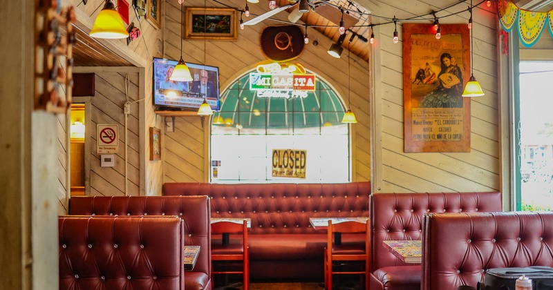 Interior dining area with upholstered booths
