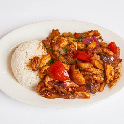 Shrimp, squid and octopus, with onions, tomatoes, cilantro, and fried potatoes.
