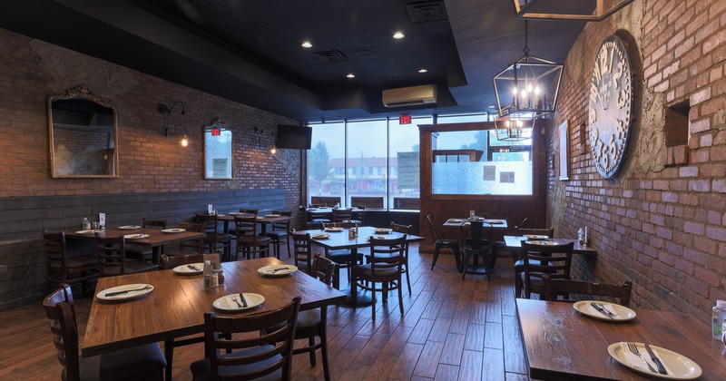 Interior, dining tables with tableware and cutlery