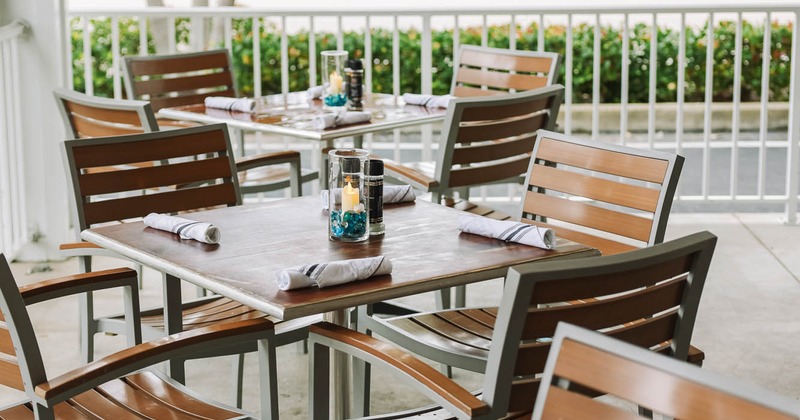 Exterior, table on patio set for guests