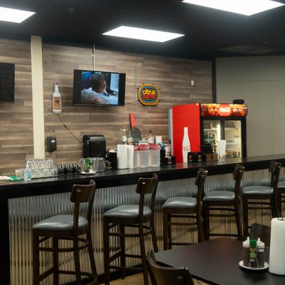 Interior, a bar and bar chairs.