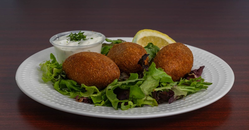 Stuffed Bulgur wheat shells served with tzatziki