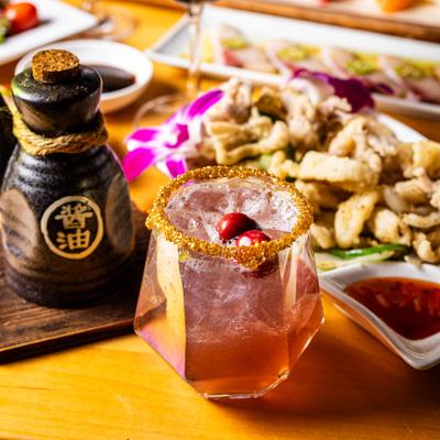 Christmas Mistletoe Margarita on a table with food.