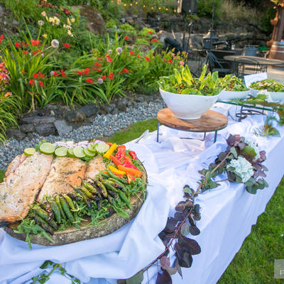 Grilled fish with chili peppers and cucumbers and salad on the table