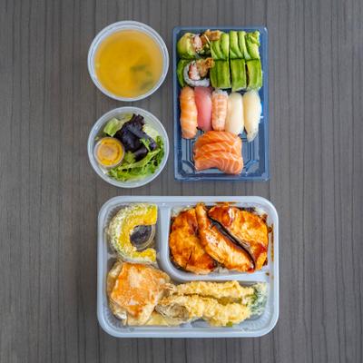 Sashimi, nigiri, sushi roll, and tempura Bento box.