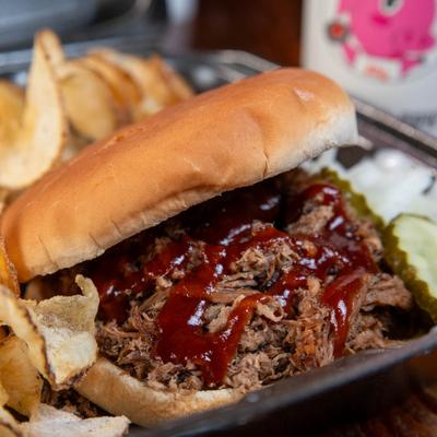 Shredded brisket sandwich, with BBQ sauce.