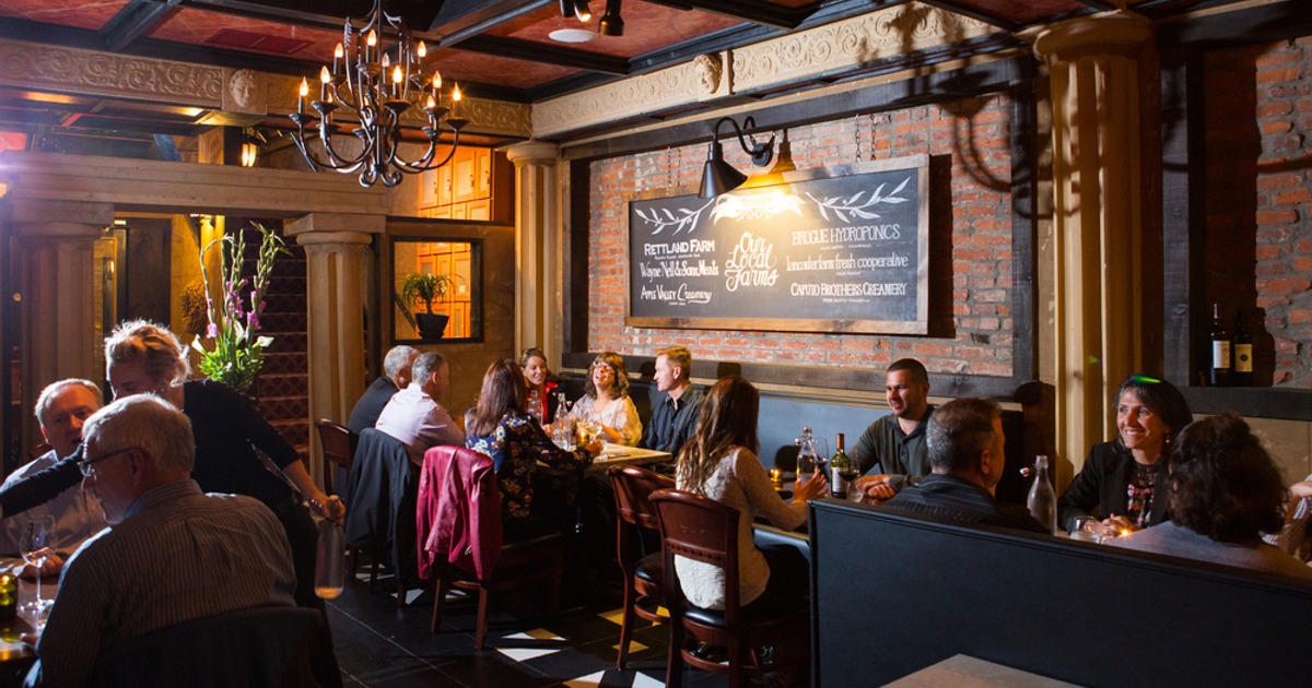 Customers sitting and having wine